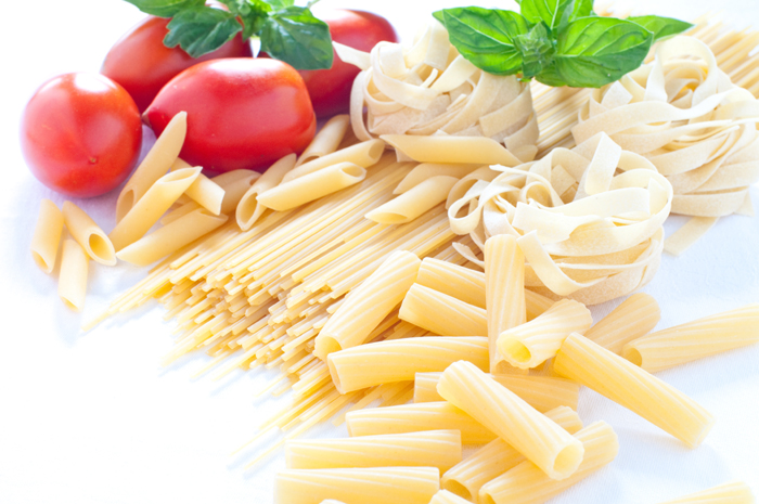 Pasta of various sizes with tomato and basil